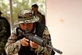 Royal Thai Special Forces service member clears a building during a mock raid, Cobra Gold, 2011