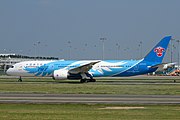 The tailfin of a China Southern Airlines Boeing 787 featuring a Bombax ceiba flower