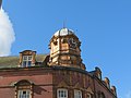 Clock face and ornament on The Bear Tavern.