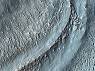 Close-up of the area in the box in the previous image. Interpreted as the terminal moraine of a glacier. For scale, the box shows the approximate size of a football field. Image taken with HiRISE under the HiWish program. Location is Hellas quadrangle.