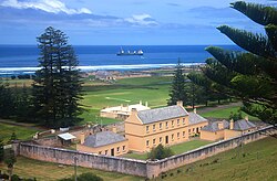 Old Military Barracks, now Legislative Assembly Chambers, with Kingston Common in background