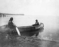 Ojibwe women in canoe on Leech Lake