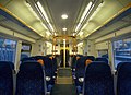 The interior of Standard Class accommodation aboard a Southeastern trains Class 375 Electrostar, showing the blue seat moquette trim.