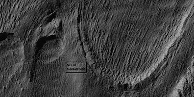 Close view of snout of glacier, as seen by HiRISE under the HiWish program. High center polygons are visible. Box shows size of football field.