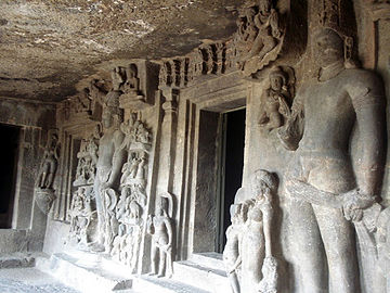 Various sculptures next to an entrance at Aurangabad Caves.