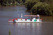 Ferry for pedestrian and cyclists in the middle of a river