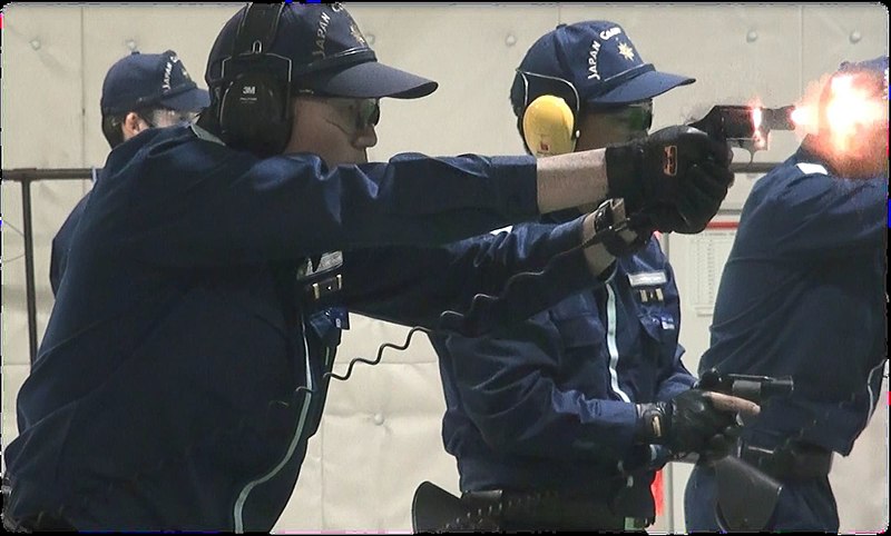 File:JCG officer firing revolver.jpg