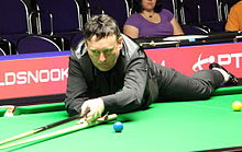 Jimmy White playing snooker