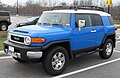 A Voodoo Blue 2007 Toyota FJ Cruiser with aftermarket nerf bars