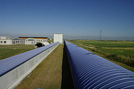 Two blue tubes, one much longer than the other