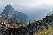 The mountain Huayna Picchu overlooks the ruins of Machu Picchu