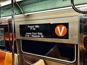 An R68A displays the V train's old bullet and destinations. Most rollsigns retain a V bullet.