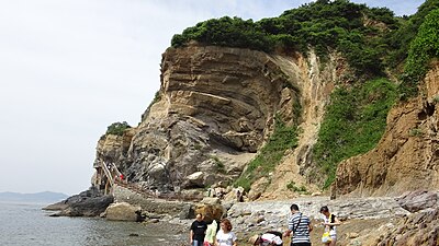 A wave-like abrasion cliff, formed by coastal erosion