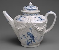 Teapot with relief and painted decoration