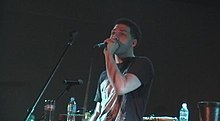 Xla singer performing.jpg