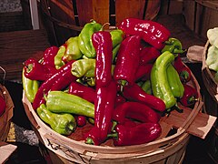 Green and red cubanelle peppers are used to make sofríto