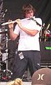 Rob Hawkins playing flute during the bands cover of Gold Digger