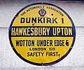 Very old AA village sign at Hawkesbury Upton, South Gloucestershire, England. The sign says that London is 103 miles away while the next village (Dunkirk) is one mile away.