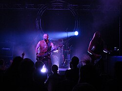 The band Mercenary performing at a concert