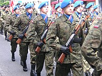 Soldiers of the Polish Army 7th Coastal Defense Brigade, wearing blue ascots striped with the flag of Poland