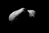 Eros, looking from one end of the asteroid across the gouge on its underside and toward the opposite end