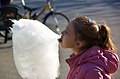 Girl eating cotton candy