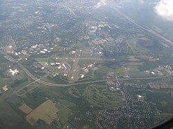 Aerial view of Ewing, looking southeast and featuring Trenton–Mercer Airport, Interstate 295, and the Delaware River