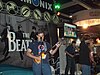 A group of 2009 Penny Arcade Expo attendees playing The Beatles: Rock Band