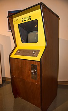 A vertical wooden structure with a visual display unit embedded in the front side.