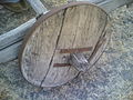 Twentieth-century solid wheel made of wooden boards, bound with a metal wheel rim