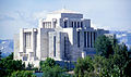 Modern photo of the cardston temple, with its signature Mayan-Aztek and Prairie School architecture style.