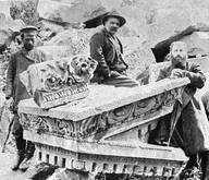 Toros Toramanian pictured sitting on part of the pediment[59]