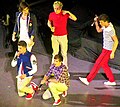 UK boy band One Direction wearing typical early 2010s preppy clothes.