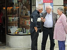 Edward Luttwak holds an issue of Lotta Comunista, Italian Left Communist monthly.