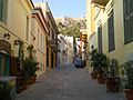 A street in the traditional and touristic old district of Plaka, just underneath the Acropolis of Athens.