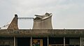 Roofline of building with hyperbolic tower visible