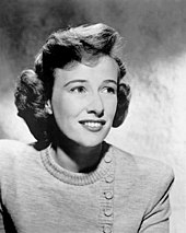 Phyllis Thaxter smiling and looking off to her left in a press head shot from 1955.