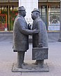 Sculpture of two men in conversation