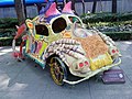 An Alebrije (Mexican artcraft) in the shape of a Volkswagen Beetle.