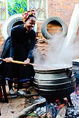 A woman stirs sorghum porridge to stop if from sticking. If the food in the pot is too thick, new liquid water cannot reach the bottom of the pot to cool it. Unless the pot is stirred soon, all the water in the bottom layer boils off. The layer of food nearest the bottom of the pot dries out, its temperature rises above the boiling point, and it chars. The food burns to the bottom of the pot.