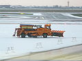 Warsaw Chopin Airport snowplow and sweeper unit in Poland