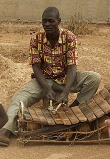 A picture of a man with xylophone