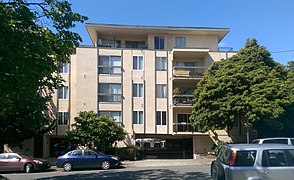 Mid-20th century apartments with soft story parking. Zoning at the time allowed four stories plus a small penthouse.