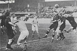 Aerial play with two Belgian players and the Luxembourg keeper trying to touch the ball