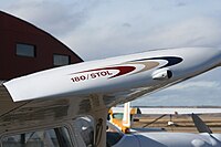 The wingtip of a Cessna 180 STOL aircraft.