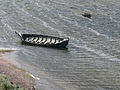 Viking Museum Foteviken in Skanör. Viking boats in the water in front of the settlement