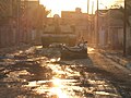 An M1A1 Abrams Main Battle Tank from A Company, 1st Battalion, 77th Armor Regiment destroys an insurgent vehicle in Baghdad, Iraq in 2007