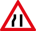 Road narrows To right