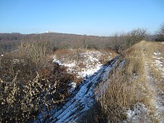 The western scarp and adjoining hill, where an ancient entrance was situated according to some works[13] (2016).