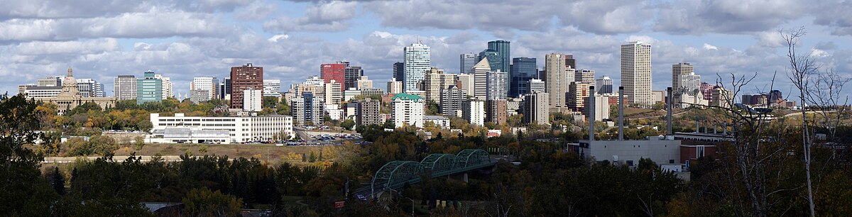 Panorama of Edmonton's skyline taken on a fall day showing the decommissioned EPCOR's Rossdale Power Plant and the Walterdale Bridge.